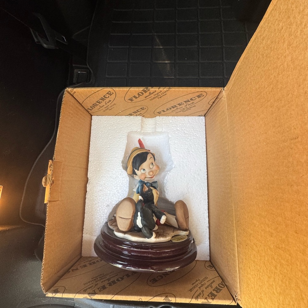 Pinocchio Figurine with Red and Black Accents